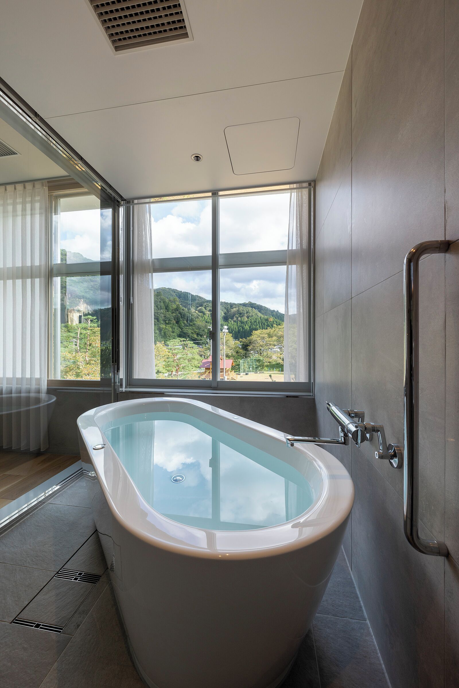 Suite, Non Smoking | Bathroom | Separate tub and shower, free toiletries, hair dryer, bathrobes