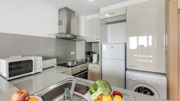Standard Apartment, Multiple Bedrooms (El Tarter Ski Apartment for Families) | Private kitchen | Fridge, microwave, oven, stovetop