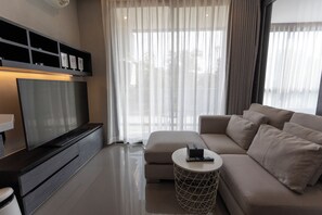 Basic Condo | Living area | Flat-screen TV