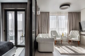 Luxury Apartment, Park View | Living area | 40-inch TV with digital channels - Studio near of Chelyuskintsev Park (Minsk)