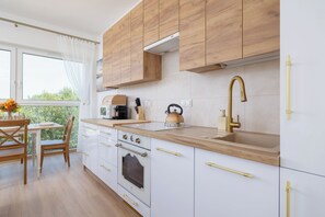 Apartment, 1 Bedroom, Balcony, Lakeside | Private kitchen | Microwave, oven, coffee/tea maker, electric kettle - Apartment With Pond View by Renters (Katowice)