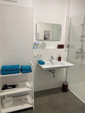 Shower, eco-friendly toiletries, hair dryer, towels