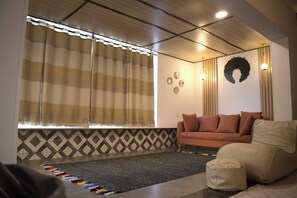Comfort Apartment, Non Smoking, Garden View | Living area | 50-inch flat-screen TV with digital channels - Arabian Nights - Modern Duplex Villa (6th of October City)