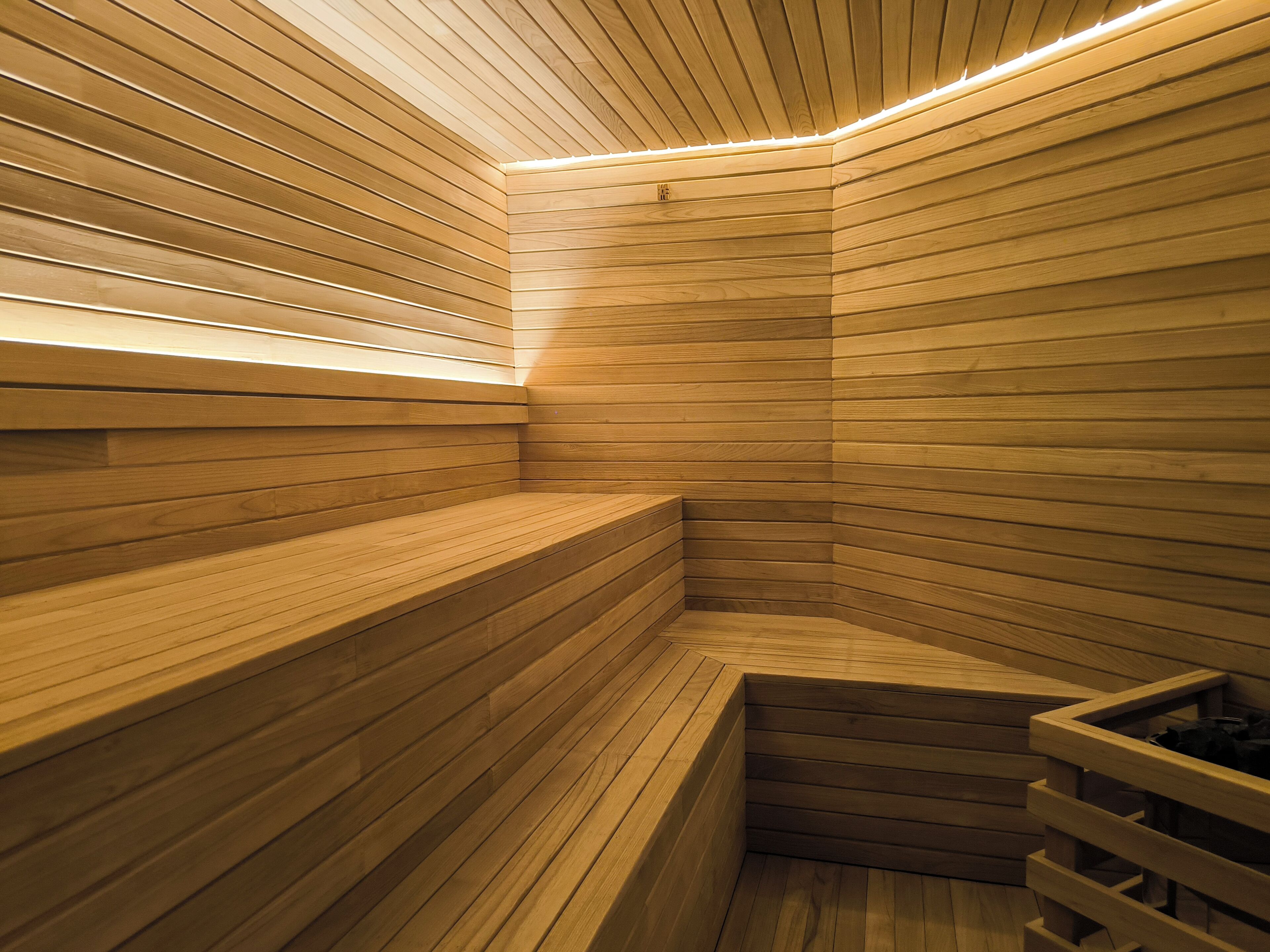 A sauna with wooden walls and benches.