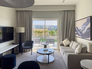 Signature Apartment | Living area | 45-inch Smart TV with satellite channels