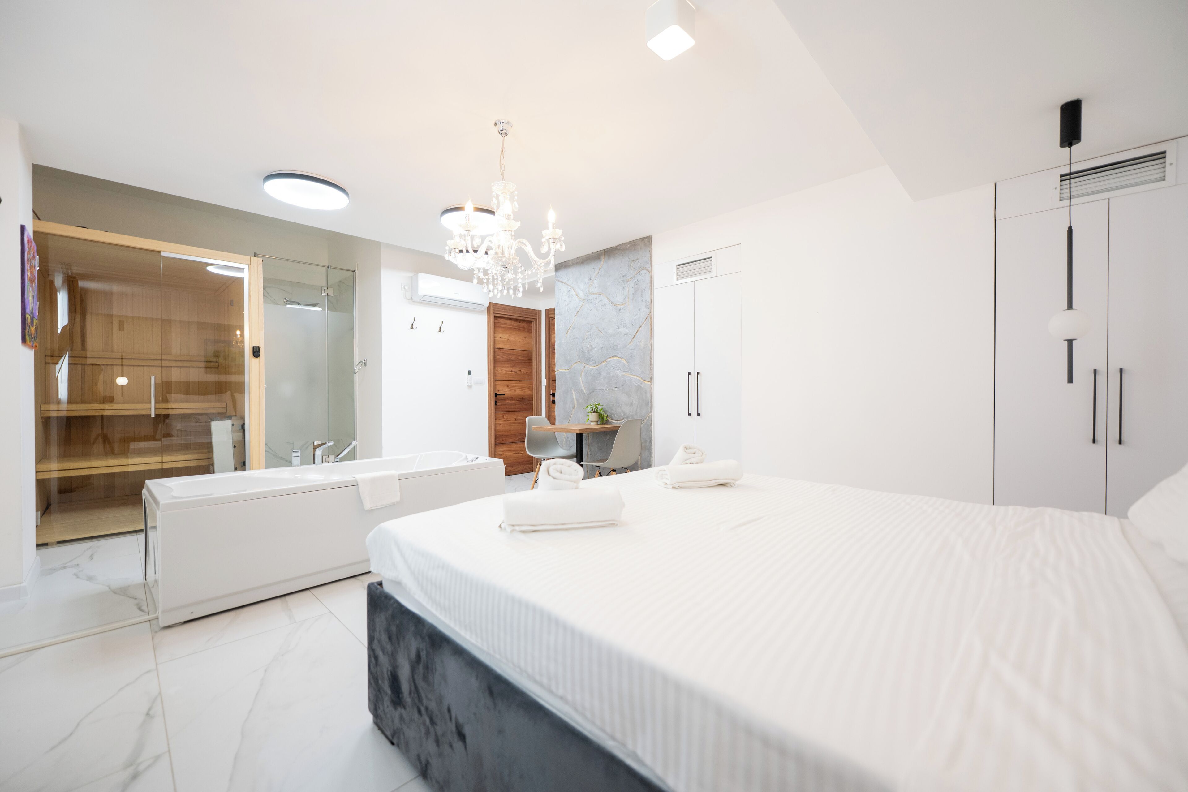 Deluxe Suite, Sauna, Basement | Bathroom | Hair dryer, slippers, towels, soap
