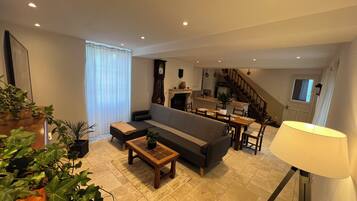 Smart TV, fireplace, foosball, books