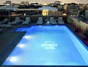 Seasonal outdoor pool, open 10:00 AM to 8:00 PM, pool umbrellas