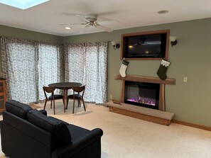 Smart TV, fireplace, DVD player, books
