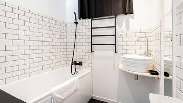 Shower, hair dryer, towels, toilet paper