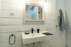 Shower, hair dryer, towels, toilet paper