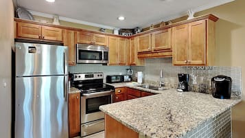 Condo, Multiple Beds, Balcony (Grand Caribbean#309 - No Pets) | Private kitchen | Fridge, microwave, oven, stovetop
