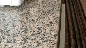 A kitchen with granite countertops, a stainless steel sink, and a small rug. - Spacious 3-bedroom house in lovely Jardim Botanico with WiFi, AC (jardim botanico)