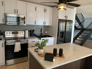 Fridge, microwave, stovetop, cookware/dishes/utensils