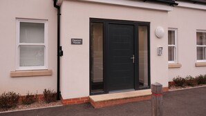 A house named 'Dawson House' with a black front door, a small window, and a white doorbell. - Stylish, Luxury Apartment Sleeps 4 - Southampton (Southampton)