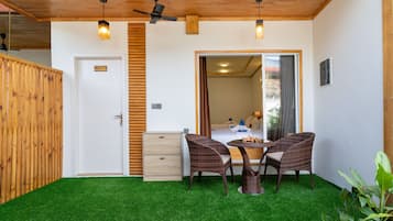 Family Quadruple Room, Patio, Garden View | In-room safe, desk, laptop workspace, blackout drapes