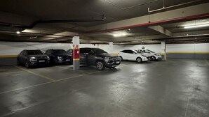 A multi-level underground parking garage with several cars parked. - Get a Flat 601 Ibirapuera -Jardins (São Paulo)