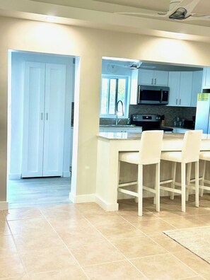 Fridge, microwave, stovetop, coffee/tea maker