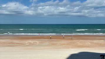 On the beach, sun loungers, beach towels