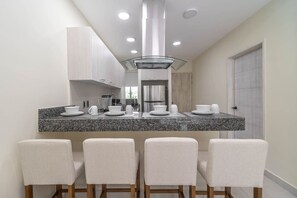 Fridge, microwave, stovetop, coffee/tea maker
