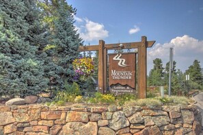 A wooden sign with the text "Mountain Thunder Lodge & Townhomes" and a stylized mountain graphic. - 2 Bedroom Ski-in Condo at Mountain Thunder Lodge (Breckenridge)