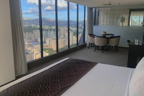 Junior Room, City View | In-room safe, desk, laptop workspace, iron/ironing board