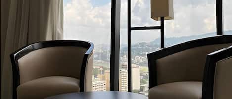 Junior Room, City View | In-room safe, desk, laptop workspace, iron/ironing board