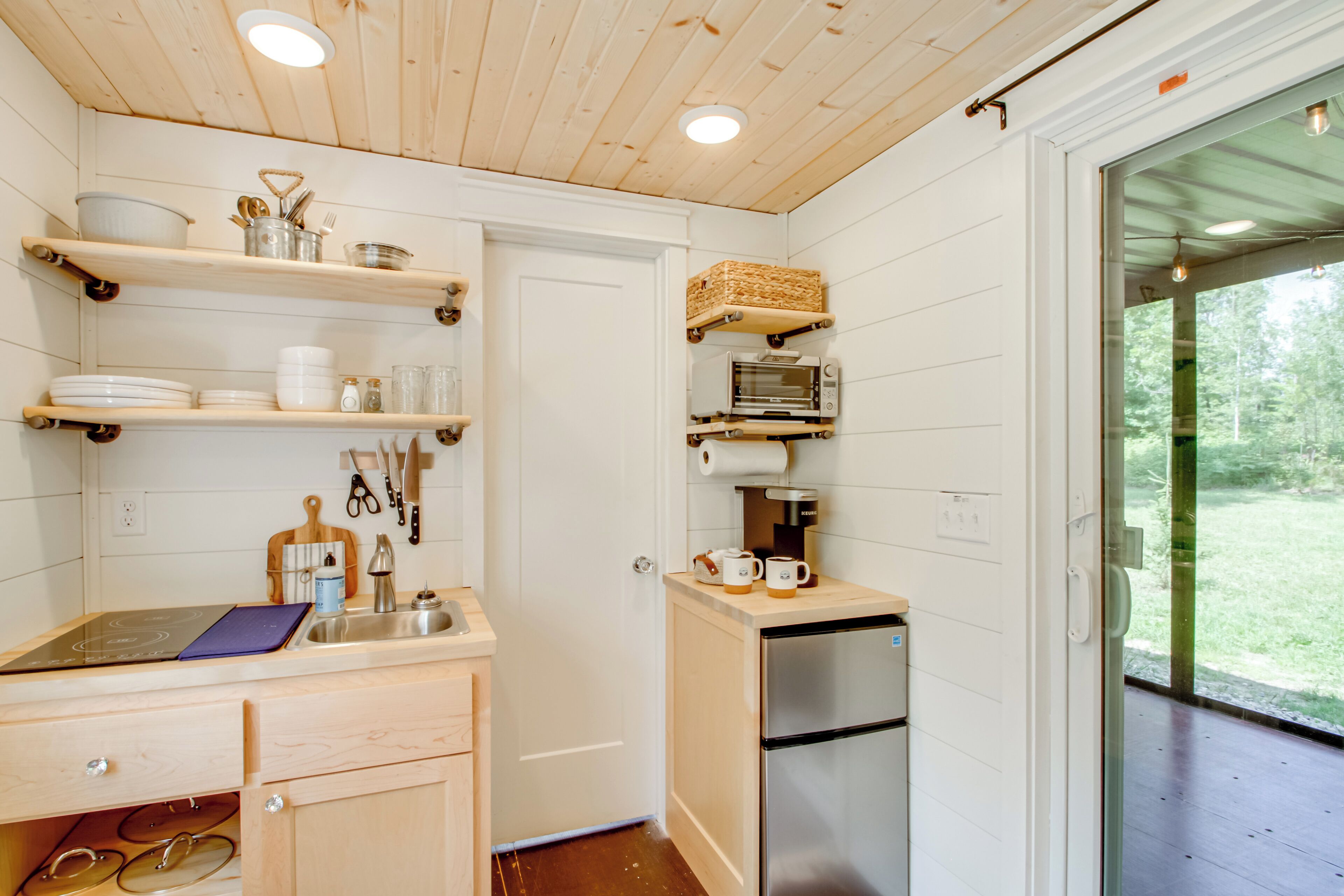 Fridge, coffee/tea maker, toaster, cookware/dishes/utensils