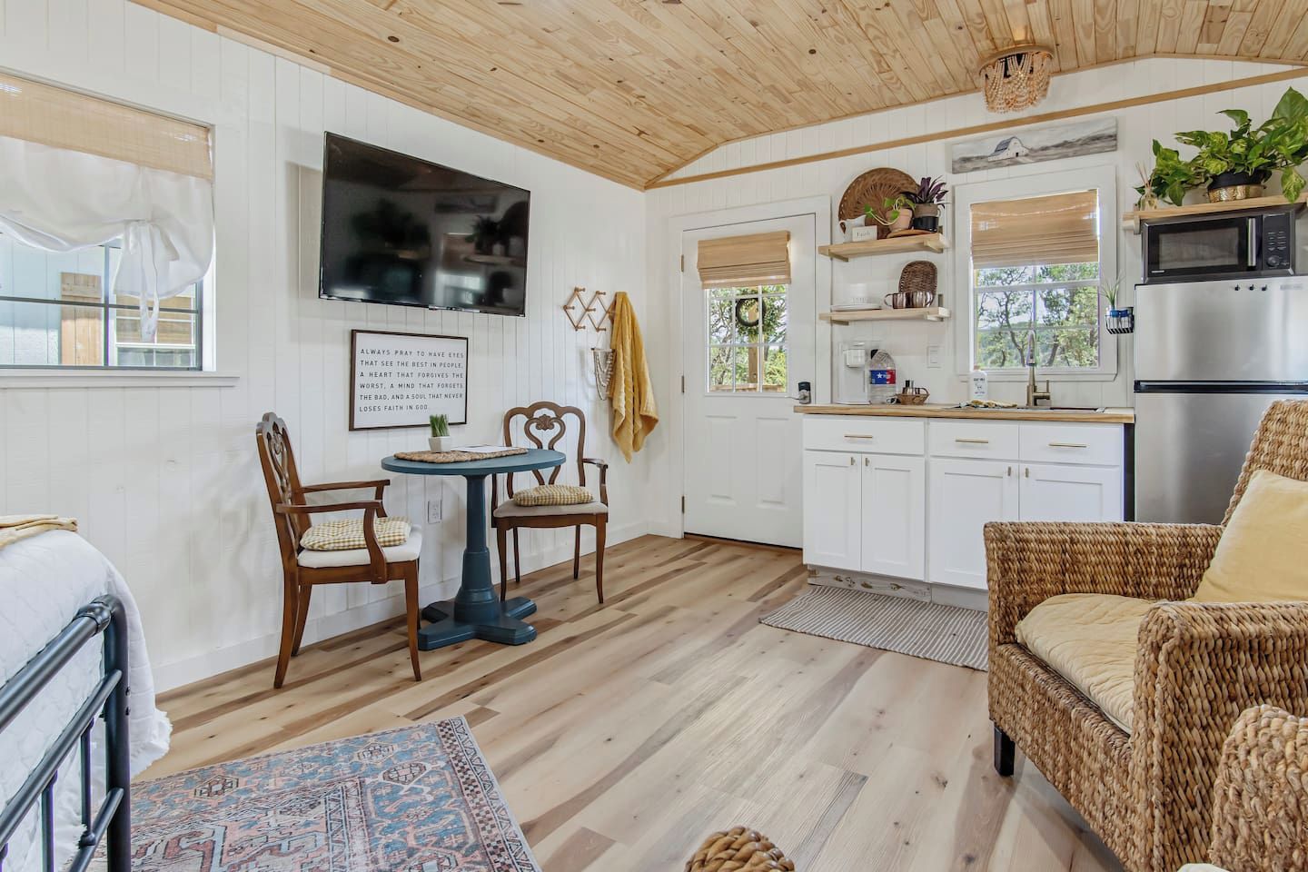 A cozy interior with a dining area, kitchen, and seating space.