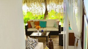 A cozy living area with a sofa, coffee table, and decorative items.