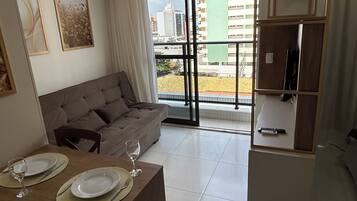 Apartment, City View | Living area | 40-inch Smart TV with digital channels
