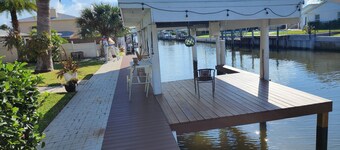 Intercostal channel house with boat dock and ping-pong table 