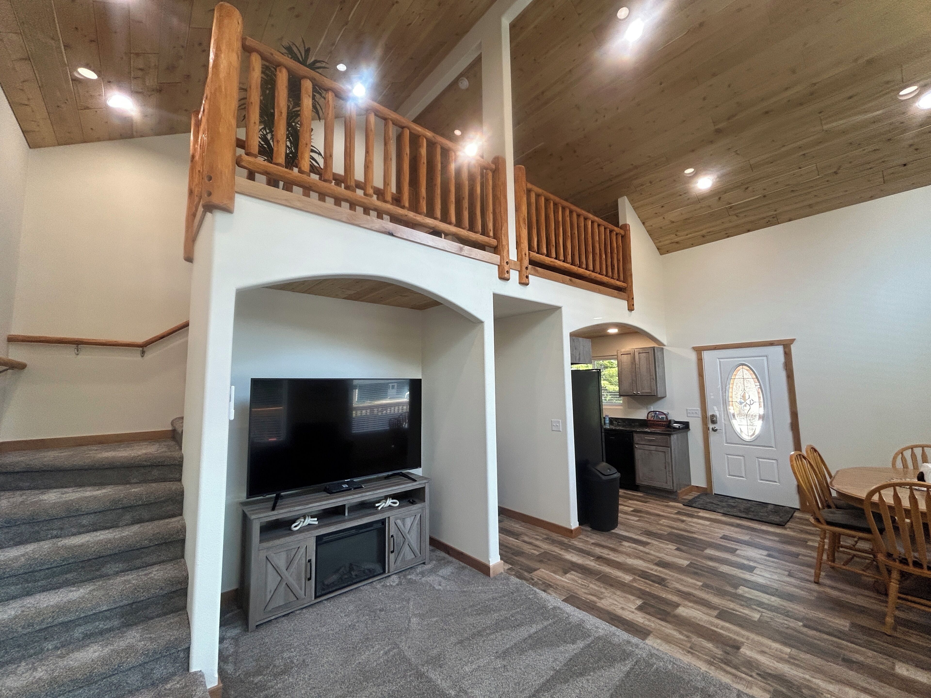 Living area with stairs to loft