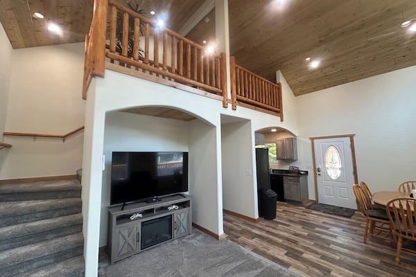 Living area with stairs to loft