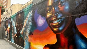 A mural on a building wall. - Hostel Distrito 011 (São Paulo)