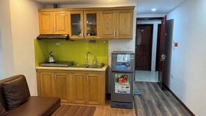 Deluxe Apartment, Kitchenette, City View | Private kitchen | Mini-fridge, electric kettle, cleaning supplies, paper towels - Era Apartment Ha Yen Quyet (Hanoi)