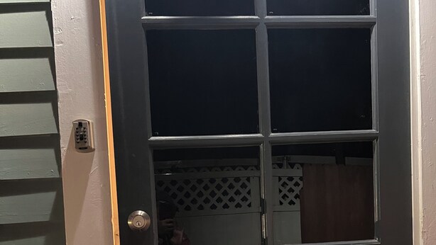 A black door with a keypad lock and a keyhole. - Charming  Bedroom. In home (Riverside)