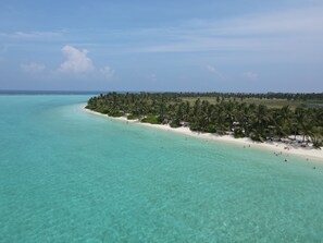 Beach nearby, white sand, beach towels