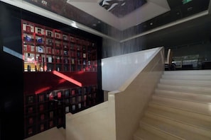 A staircase with a modern design, leading to a lower level.