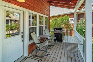 A covered porch with a grill, rocking chairs, and a table. - Darling Dover Sleeps 8 - Marina, beach, trails (Dover)