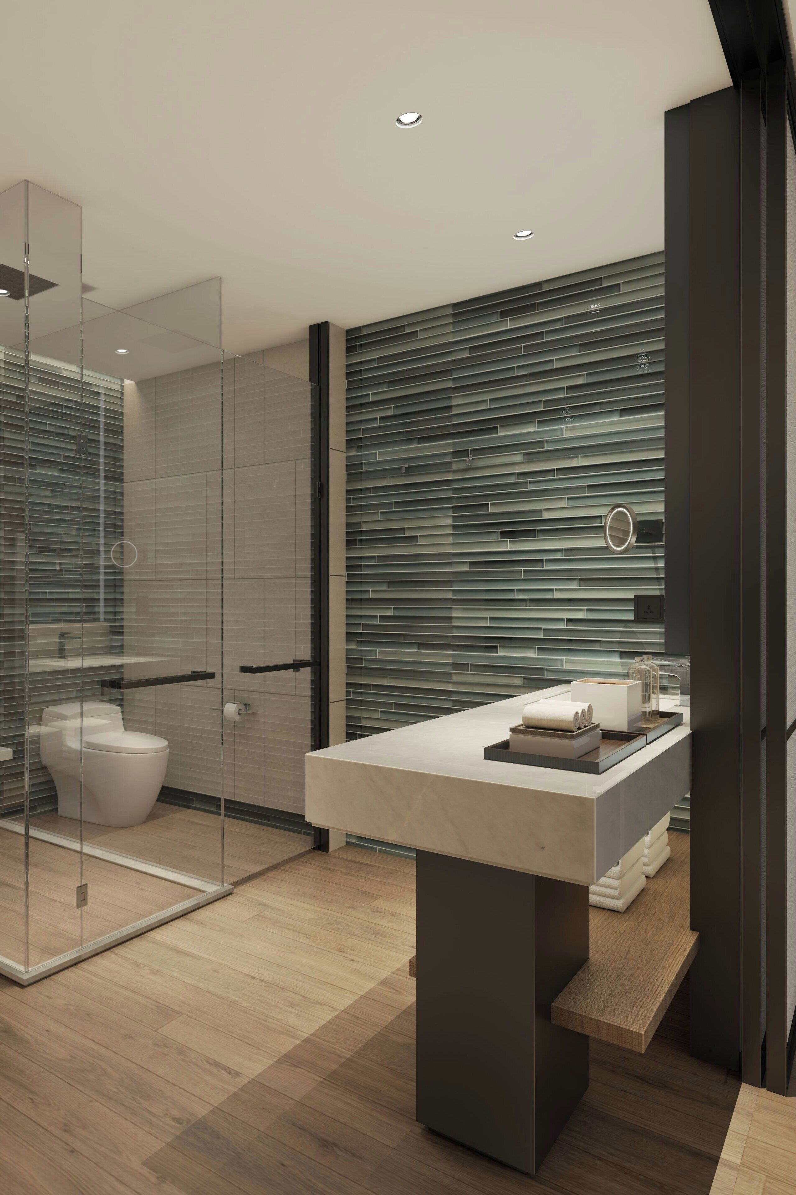 A modern bathroom with a glass shower enclosure, a white toilet, a large mirror, and a wooden vanity with a sink.