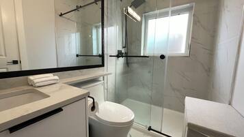 Shower, towels, toilet paper