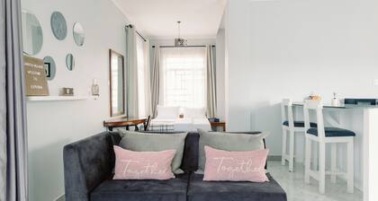 Sarita Village Homes- Cozy studio suite with a full kitchen and sitting area