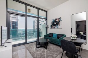Comfort Apartment, 1 Bedroom, Balcony, City View | Living room | 50-inch Smart TV with digital channels - Stylish 1BR at DAMAC Merano Tower (Dubai)