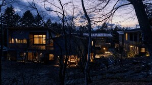 A modern multi-story house with multiple illuminated windows and a visible outdoor area. - GLAMDAY STYLE HOTEL SUITE YAMANOFUMOTO (Karuizawa)