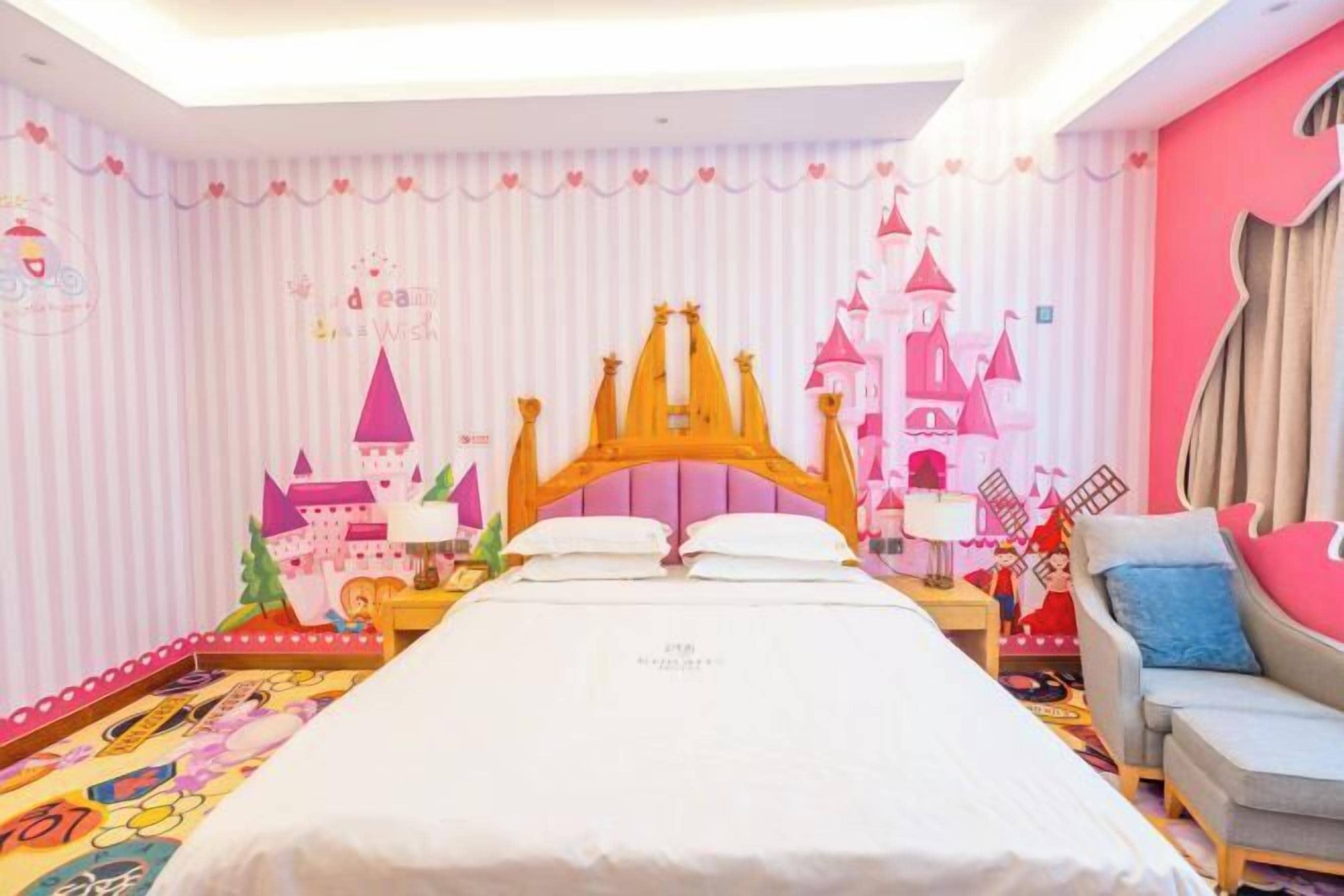 A bedroom with a bed, a nightstand, a dresser, and a chair.