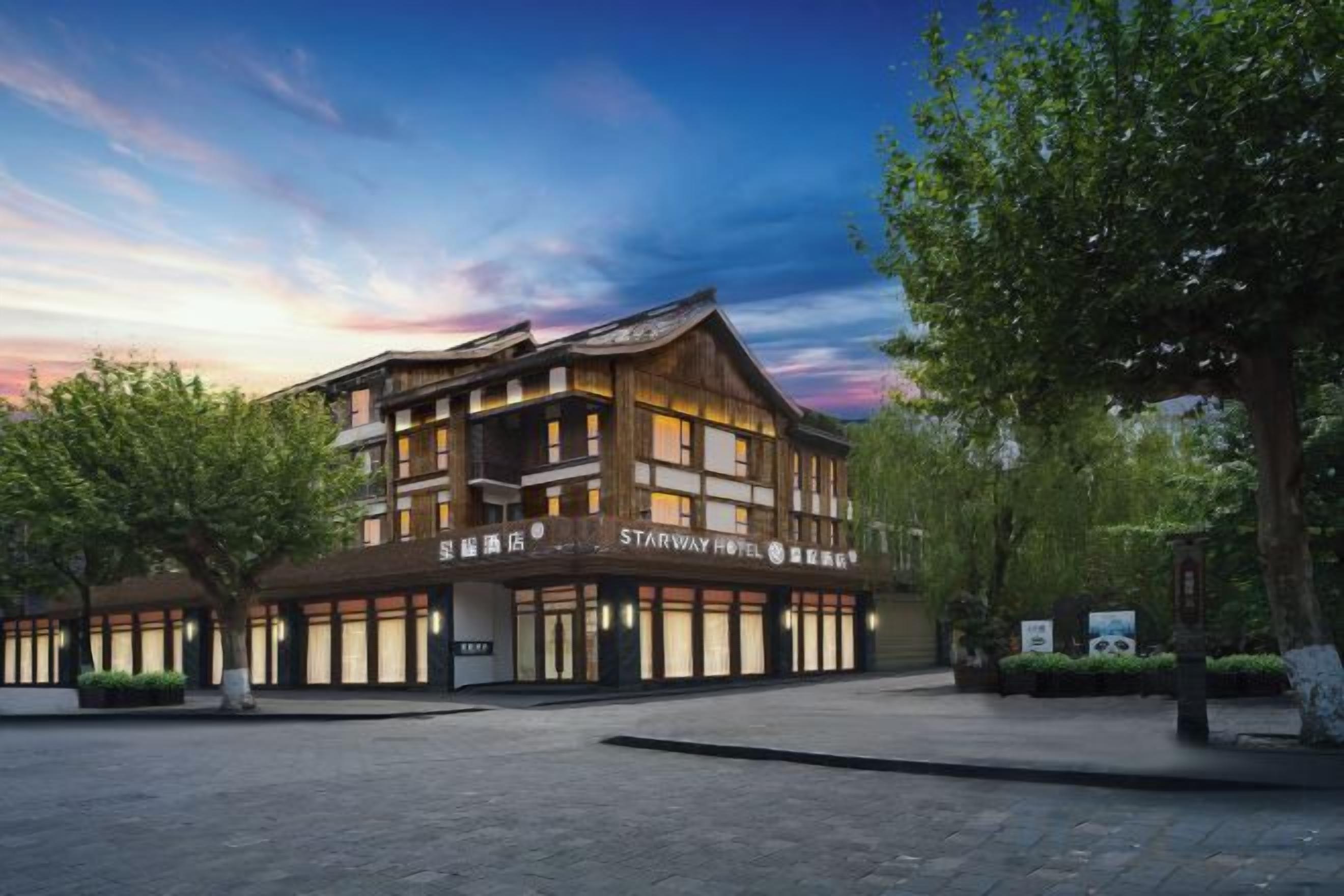 A hotel with a traditional architectural style, multiple floors, and a spacious entrance area.
