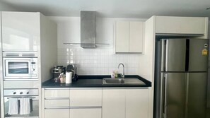 Fridge, microwave, stovetop, coffee/tea maker