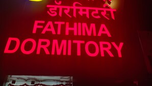 A sign for Fathima Dormitory with a logo and text in both English and Hindi. - Fathima Dormitory (Mumbai)
