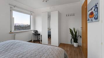 1 bedroom, desk, iron/ironing board, travel crib